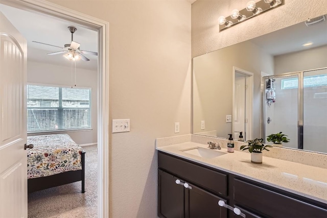 2232 Baugh Rd, Austin, TX 78754 - full bathroom featuring vanity, plenty of natural light, ceiling fan, and connected bathroom