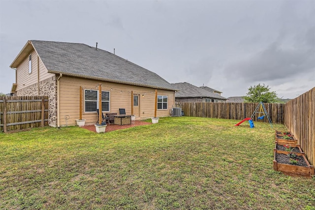 2232 Baugh Rd, Austin, TX 78754 - back of house with central air condition unit and a vegetable garden