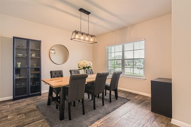 2232 Baugh Rd, Austin, TX 78754 - dining area with baseboards and dark wood-style floors