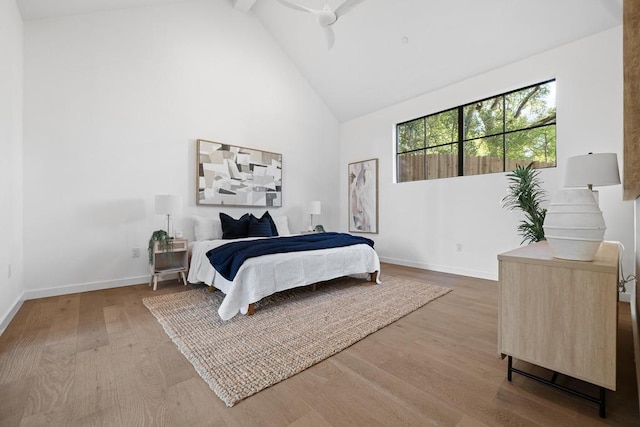 3412 Rosefinch Trl, Austin, TX 78746 - bedroom with high vaulted ceiling and wood finished floors