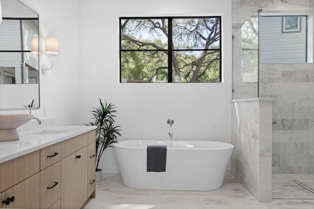 3412 Rosefinch Trl, Austin, TX 78746 - bathroom with marble finish floors, double vanity, a soaking tub, and a walk in shower
