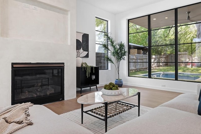 3412 Rosefinch Trl, Austin, TX 78746 - living area with wood finished floors and a glass covered fireplace