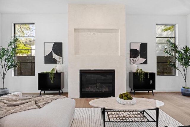 3412 Rosefinch Trl, Austin, TX 78746 - living room with wood finished floors and a glass covered fireplace