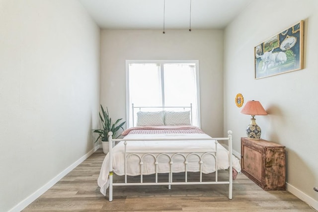 1132 W Clark St, Bartlett, TX 76511 - bedroom featuring wood finished floors and baseboards
