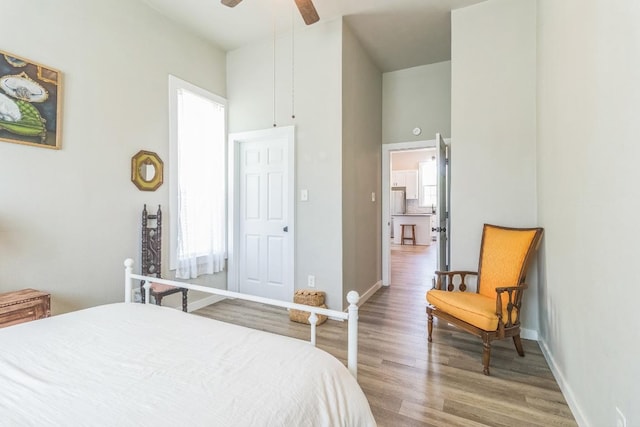 1132 W Clark St, Bartlett, TX 76511 - bedroom featuring wood finished floors, baseboards, a towering ceiling, and ceiling fan