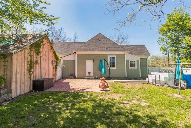 1132 W Clark St, Bartlett, TX 76511 - rear view of property featuring a patio area and a shingled roof