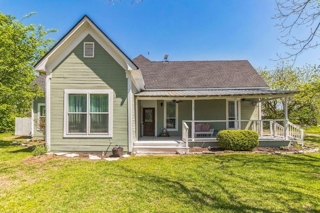 1132 W Clark St, Bartlett, TX 76511 - view of front of home with roof with shingles, a ceiling fan, a porch, and a front yard
