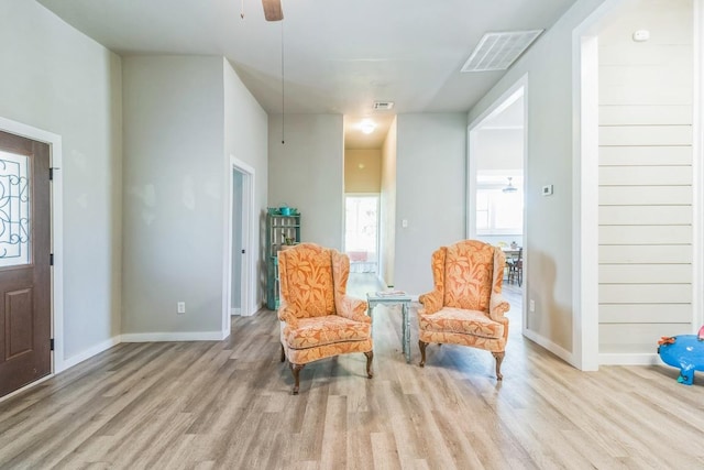 1132 W Clark St, Bartlett, TX 76511 - living area featuring wood finished floors, baseboards, and ceiling fan