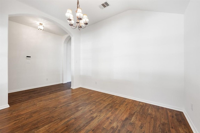18513 Silent Water Way, Pflugerville, TX 78660 - spare room with arched walkways, dark wood finished floors, lofted ceiling, and a chandelier