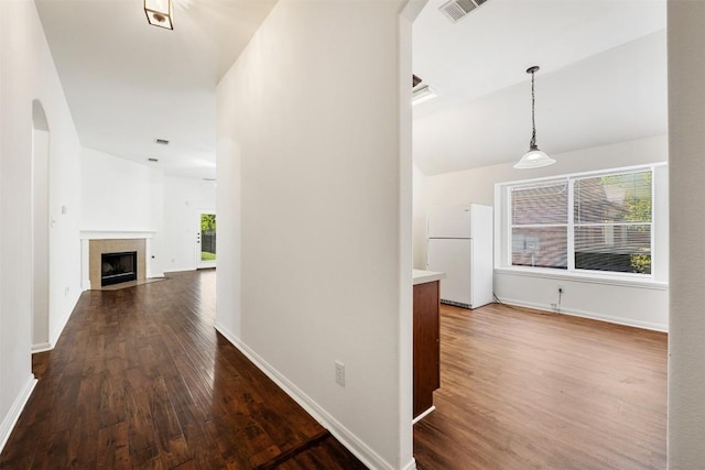 18513 Silent Water Way, Pflugerville, TX 78660 - hallway featuring dark wood-type flooring, healthy amount of natural light, and arched walkways