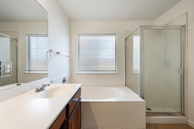 18513 Silent Water Way, Pflugerville, TX 78660 - bathroom with vanity, a shower stall, a garden tub, and tile patterned floors