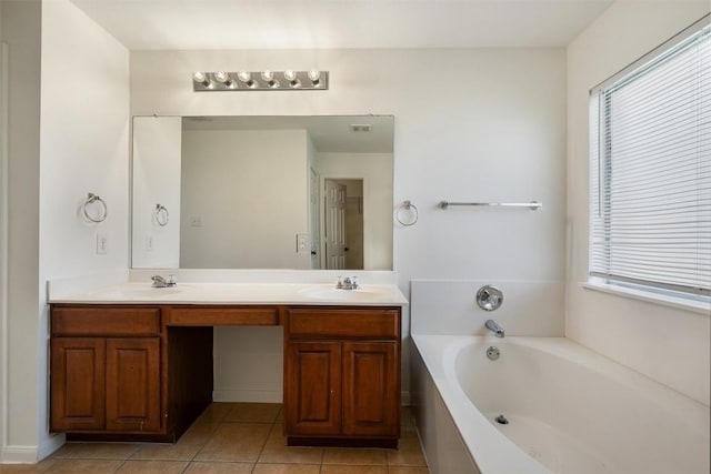 18513 Silent Water Way, Pflugerville, TX 78660 - full bathroom with double vanity, a garden tub, plenty of natural light, and tile patterned floors