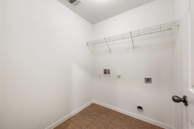 18513 Silent Water Way, Pflugerville, TX 78660 - washroom featuring electric dryer hookup, hookup for a washing machine, gas dryer hookup, and tile patterned floors