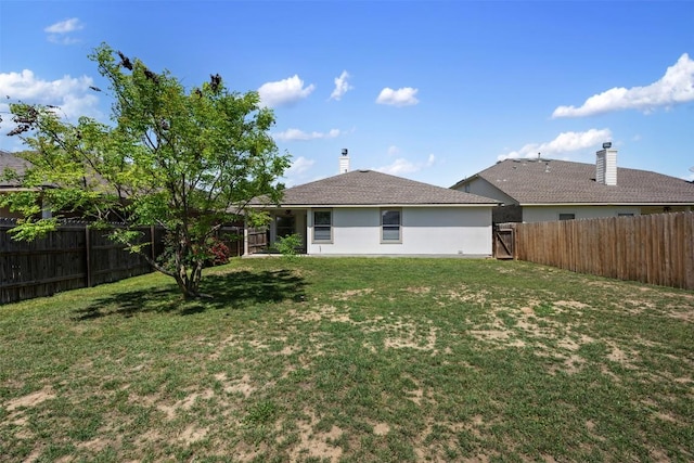 18513 Silent Water Way, Pflugerville, TX 78660 - back of property featuring a fenced backyard and a chimney