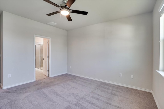 empty room featuring baseboards, ceiling fan, carpet, and visible vents