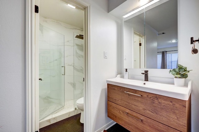 full bath with a marble finish shower, visible vents, toilet, and vanity