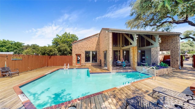 pool featuring a deck and fence