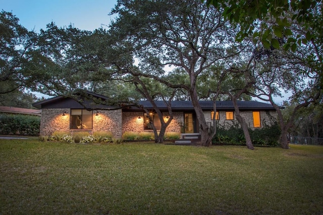 201 Westwood Ter, West Lake Hills, TX 78746 - view of front facade featuring a front lawn and stone siding