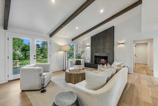 201 Westwood Ter, West Lake Hills, TX 78746 - living room with baseboards, beamed ceiling, light wood-style floors, and a large fireplace