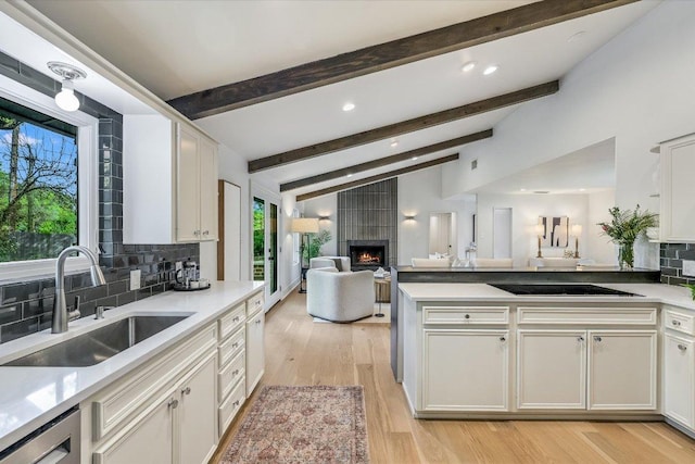201 Westwood Ter, West Lake Hills, TX 78746 - kitchen with a sink, a wealth of natural light, open floor plan, and lofted ceiling with beams