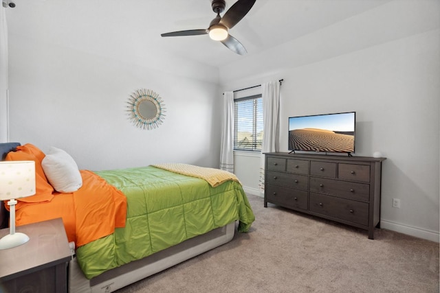 carpeted bedroom featuring a ceiling fan and baseboards