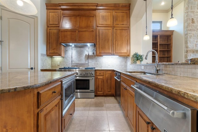 11913 Preserve Vista Ter, Austin, TX 78738 - kitchen featuring appliances with stainless steel finishes, brown cabinets, stone countertops, a sink, and a warming drawer