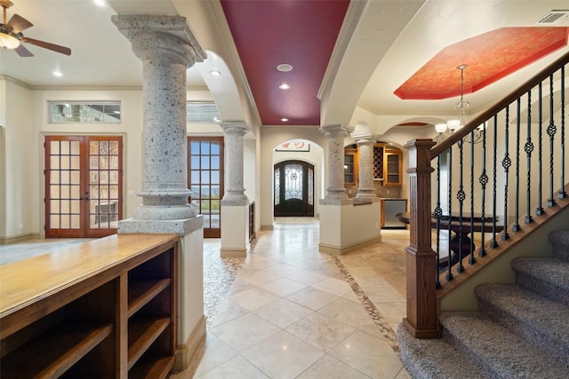 11913 Preserve Vista Ter, Austin, TX 78738 - entryway with decorative columns, baseboards, crown molding, light tile patterned flooring, and french doors