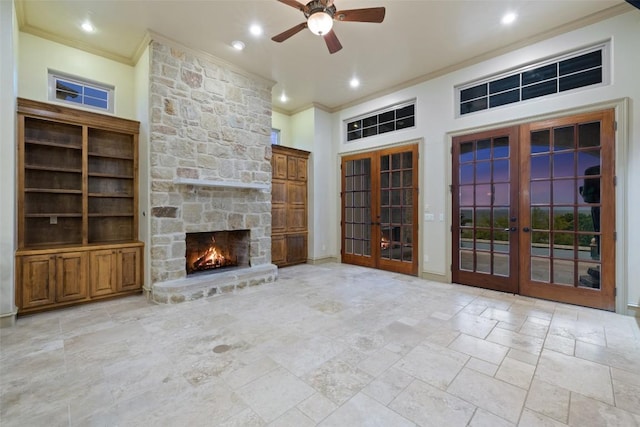 11913 Preserve Vista Ter, Austin, TX 78738 - unfurnished living room with french doors, crown molding, a stone fireplace, ceiling fan, and recessed lighting