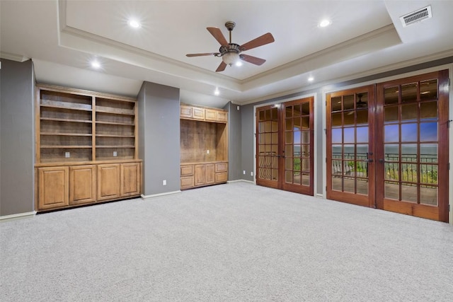 11913 Preserve Vista Ter, Austin, TX 78738 - unfurnished living room featuring a raised ceiling, ceiling fan, crown molding, carpet, and recessed lighting