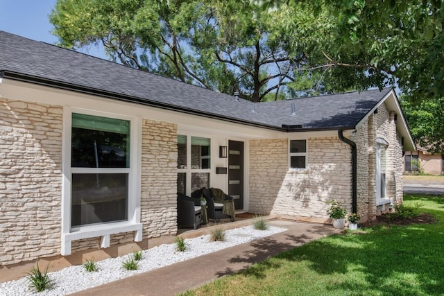 2608 Coatbridge Dr, Austin, TX 78745 - exterior space featuring stone siding, roof with shingles, and covered porch