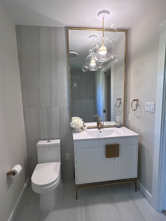 2608 Coatbridge Dr, Austin, TX 78745 - half bath with a chandelier and vanity