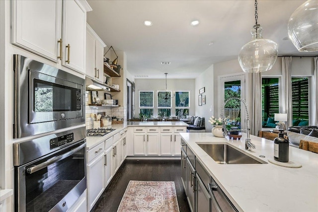 340 Fort Cobb Way, Georgetown, TX 78628 - kitchen featuring stainless steel appliances, dark wood finished floors, pendant lighting, decorative backsplash, and recessed lighting