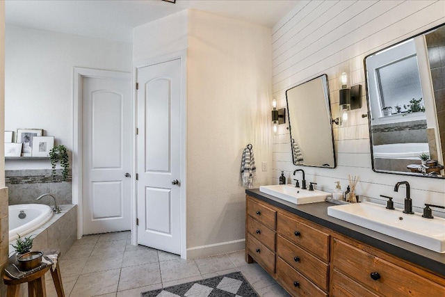 340 Fort Cobb Way, Georgetown, TX 78628 - full bath featuring double vanity, a garden tub, and tile patterned flooring