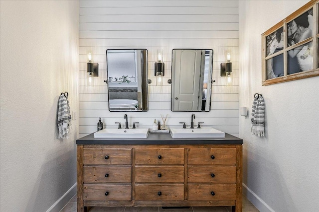 340 Fort Cobb Way, Georgetown, TX 78628 - full bathroom with double vanity and baseboards