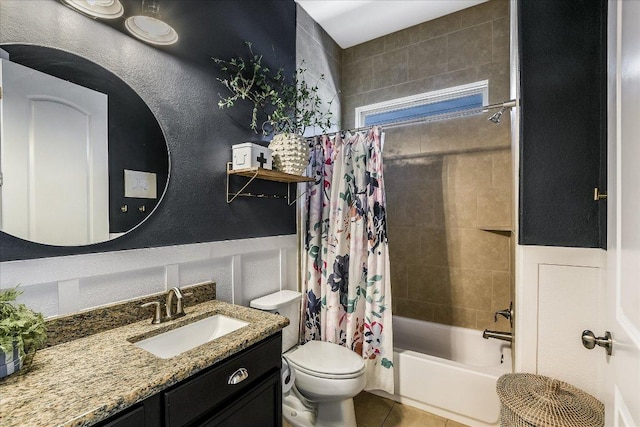 340 Fort Cobb Way, Georgetown, TX 78628 - bathroom featuring vanity, shower / bath combination with curtain, wainscoting, and tile patterned flooring