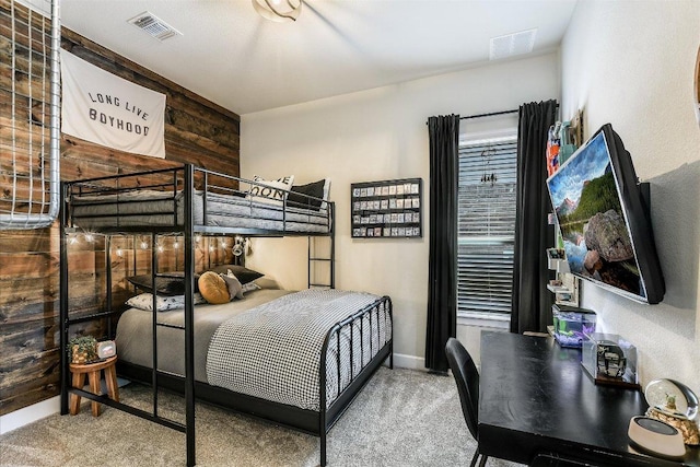 340 Fort Cobb Way, Georgetown, TX 78628 - carpeted bedroom with wooden walls and baseboards
