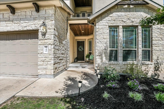 340 Fort Cobb Way, Georgetown, TX 78628 - entrance to property featuring stone siding and a garage