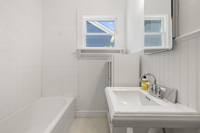 1114 Reagan Ter, Austin, TX 78704 - bathroom featuring tile patterned flooring, a wainscoted wall, and a sink
