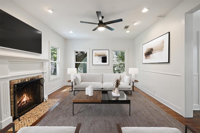 1114 Reagan Ter, Austin, TX 78704 - living area with ceiling fan, a fireplace with flush hearth, baseboards, wood finished floors, and recessed lighting
