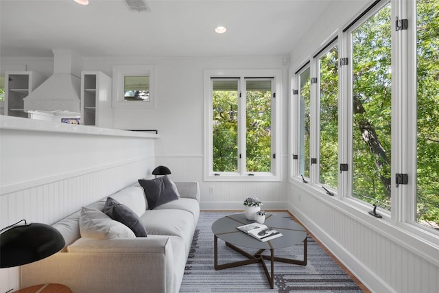 1114 Reagan Ter, Austin, TX 78704 - sunroom with healthy amount of natural light, a wainscoted wall, and recessed lighting