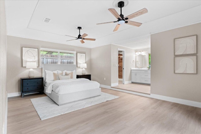 bedroom with visible vents, baseboards, ensuite bathroom, ornamental molding, and light wood-style floors