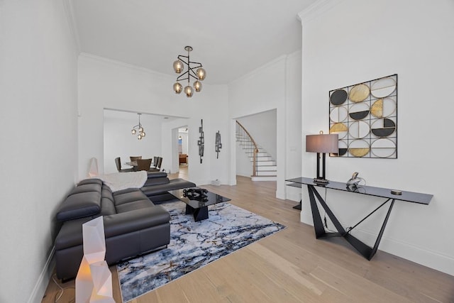 1409 Vibar Cv, Round Rock, TX 78681 - living area with a chandelier, stairs, crown molding, and light wood-type flooring