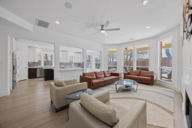 1409 Vibar Cv, Round Rock, TX 78681 - living area featuring a ceiling fan, light wood-style flooring, and recessed lighting