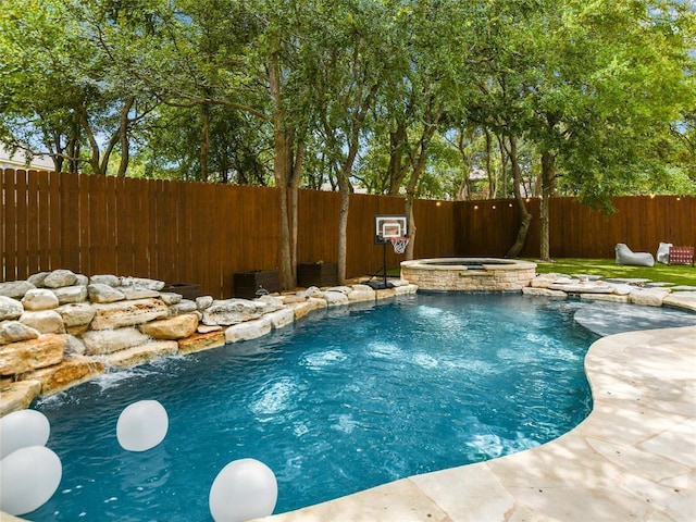 1409 Vibar Cv, Round Rock, TX 78681 - view of pool with a fenced backyard and a pool with connected hot tub