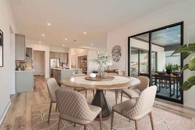 300 Alava Way, Georgetown, TX 78628 - dining space with light wood-style floors, recessed lighting, and baseboards