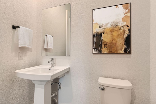 300 Alava Way, Georgetown, TX 78628 - bathroom featuring toilet and a textured wall