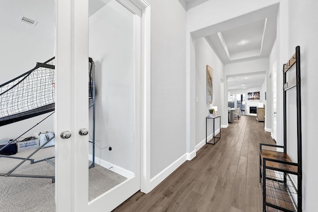 2831 Tanager Trce, Katy, TX 77493 - hallway with wood finished floors and a raised ceiling