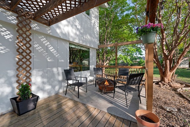 deck featuring a fire pit and a pergola