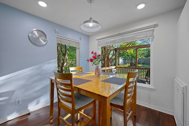 dining room with baseboards, recessed lighting, and wood finished floors