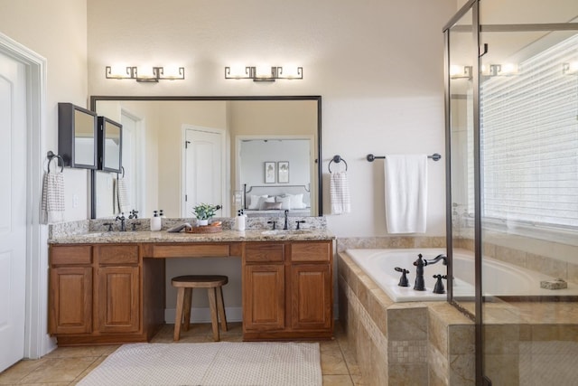 103 Aria Rdg Unit 902, Austin, TX 78738 - bathroom with a bath, double vanity, tile patterned floors, and a stall shower